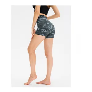 Macro shot of high-waist camo fitness shorts showing the fabric texture and elastic fit