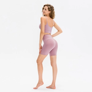 Women's mauve yoga set with high waist compression shorts and thin strap sports bra
