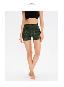 Detail view of high waisted fitness shorts featuring green camo print and reinforced stitching