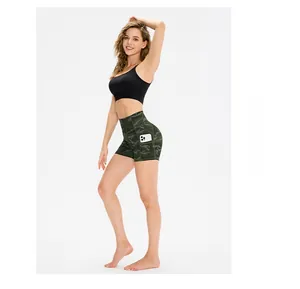 Detail view of high waisted camo sports shorts with side pocket holding a smartphone