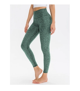 Detail shot of high-waist yoga leggings featuring grey-green leopard camo print pattern