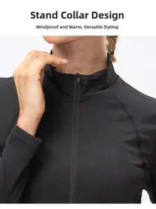 Detail of slim fit athletic top showing stand-up collar and high-quality front zipper