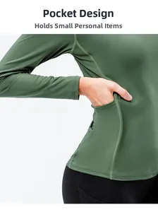 Detail of functional side pocket on dark green long sleeve athletic yoga shirt