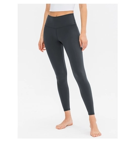 Detailed view of high-waisted dark grey yoga leggings with tummy control and lifting effect