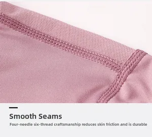 Vue macro des coutures plates et de l'empiècement mesh sur ce haut de yoga rose respirant