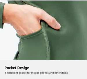 Detail view of functional side pocket on olive green athletic long sleeve yoga top