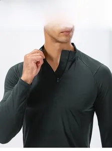 Detail of quarter-zip stand-up collar on men's slim fit green athletic sweatshirt