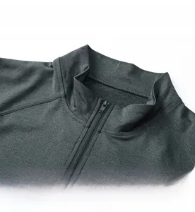 Detail of men's quarter-zip sports sweatshirt showing stand collar and grey textured fabric