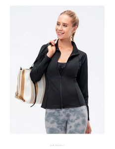 Close-up of slim fit black sports jacket with stand collar and zipper for yoga and running