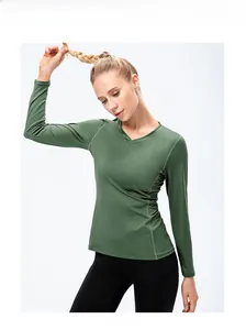 Olive green slim fit yoga top with V-neckline and structural stitching detail