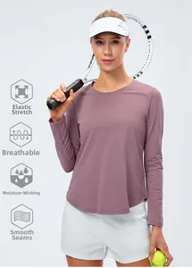 Detail view of moisture-wicking fabric on this mauve long sleeve yoga top for women