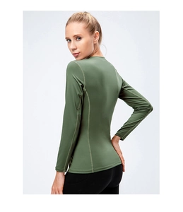 Close-up of slim-fit olive green athletic long sleeve shirt with breathable stretch fabric
