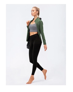Detail of slim-fit yoga jacket with zipper and high-waist leggings with side pocket