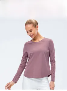 Detail of loose fit long sleeve yoga shirt in dusty pink with breathable fabric