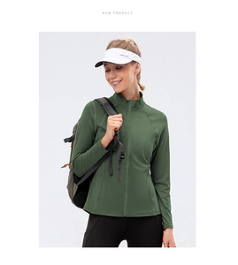 Detail view of dark green zip-up sports jacket with high collar and slim fit design
