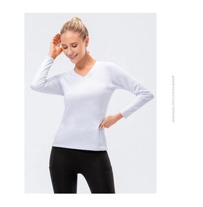 Detail of white V-neck yoga top featuring breathable quick-dry stretch fabric and slim fit