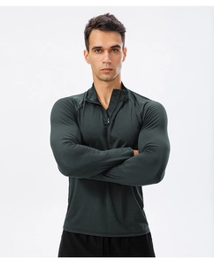 Front detail of men's slim fit dark grey half-zip sports sweatshirt with mock neck collar