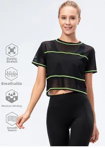 Detail of black mesh workout top with neon green stripes and breathable athletic fabric