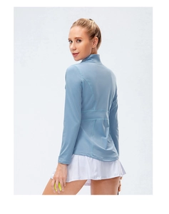 Detail view of the breathable back stitching on a slim-fit blue long sleeve sports jacket