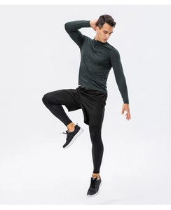 Detail of high-elasticity quick-dry men's gym set with half-zip top and compression pants