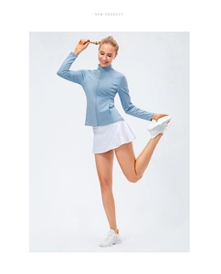 Close-up of light blue zip-up sports jacket with stand collar and quick-dry fabric