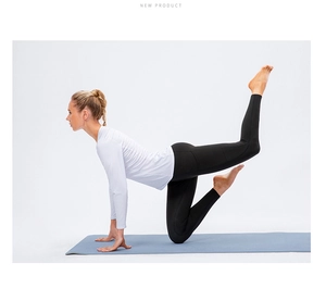 Close-up of white slim fit long sleeve yoga top with breathable elastic fabric detail