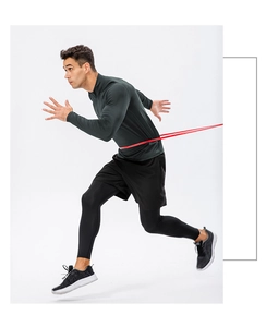 Dynamic running view of men's thermal workout set with half-zip top and compression tights