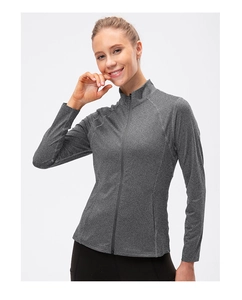 Detail of high-stretch moisture-wicking fabric on a heather grey zip-up fitness jacket