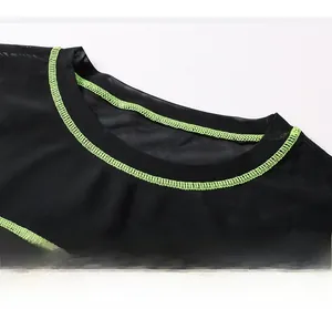 Detail of round neck with bright green contrast stitching on black mesh sports top