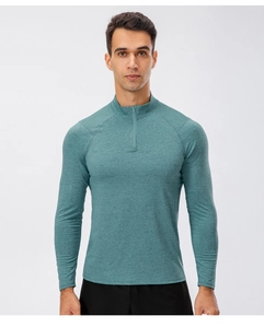Close-up of men's gym sweatshirt featuring a functional half-zip stand collar in teal