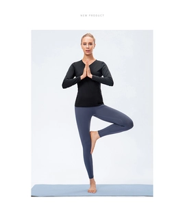 Detail of V-neck long sleeve yoga top and high-waist leggings on active model