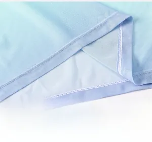 Detailed close-up of sky blue mesh fabric seams and high-waist hem on sports t-shirt
