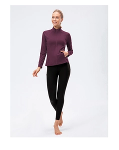Detailed side pocket of women's long sleeve sports jacket and tight yoga leggings