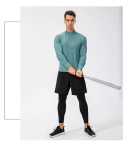 Men's green half-zip fitness top with raglan sleeves and quick-dry fabric for sports