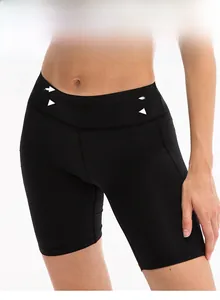 Detail showing high-waist tummy control and compression fabric of black yoga shorts