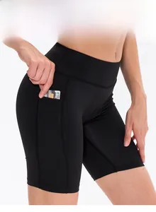 Close-up of black high-waisted yoga shorts featuring a functional side pocket for cards