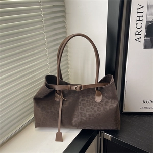 Large vintage leopard print tote bag in brown suede with decorative strap and long tassel