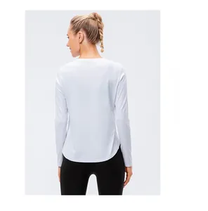 Back view of a white long sleeve yoga top with curved hem and quick-dry fabric