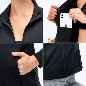 Macro details of black slim-fit zip-up sports jacket showing collar and hidden phone pocket
