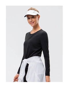 Detail of black long-sleeve yoga top with breathable fabric and slim-fit crew neck design
