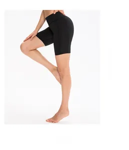 Side view of black high waisted yoga shorts showing stretch fabric and reinforced seams