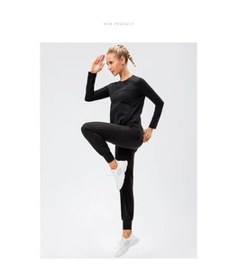 Detailed view of the elastic cuffs and high-performance fabric on women's gym yoga suit