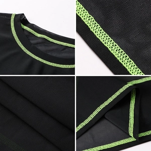 Loose black mesh sports top for women with neon green stitching and breathable texture