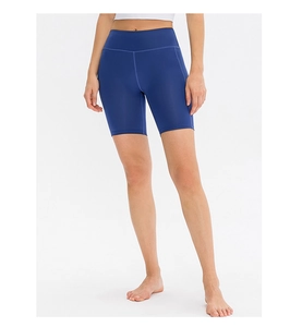 Detailed close-up of dark blue high-waisted yoga shorts with seamless stitching and matte finish