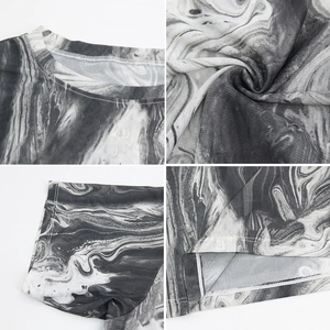 Detail view of mesh texture, marble pattern, and reinforced stitching on loose sports top