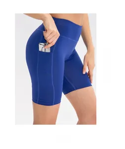 Detail of high-waisted blue yoga shorts featuring a side pocket for cards and keys