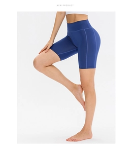 Close-up of blue high-waisted yoga shorts with side pockets and quick-dry fabric