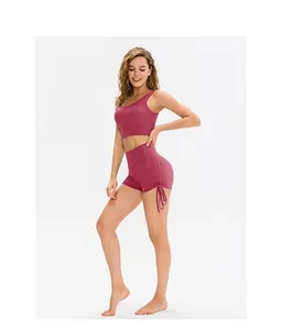 Detail view of high waist yoga shorts with side drawstring in dusty rose fabric