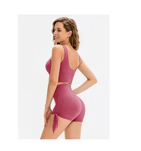 Detail of adjustable drawstring side ruching on high-waisted yoga shorts in dusty rose