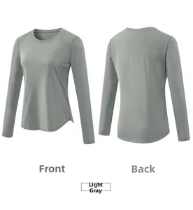 Front and back views of light grey long sleeve yoga top with curved hem detail